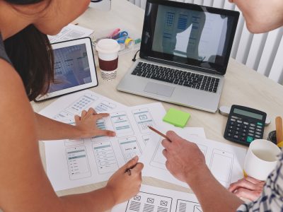 ux-and-ui-designers-discussing-project.jpg