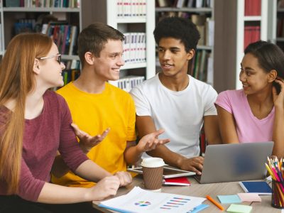 young-college-students-studying-together-at-library.jpg